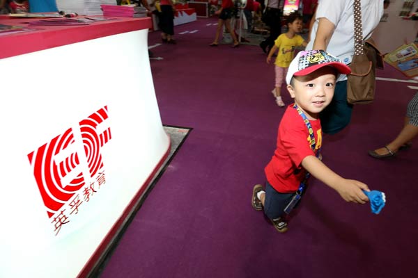 A booth of EF Education First at the China National Convention Center in Beijing attracts a lot of visitors at a recent education and culture exhibition. CHINA DAILY