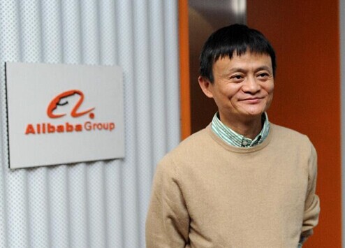 File photo shows founder and chairman of Alibaba Ma Yun poses for photos in front of Alibaba logo in Alibaba Group in Hangzhou, capital of east China's Zhejiang Province.