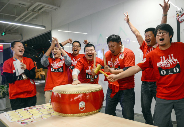Alibabas Tmall sales team celebrates its bumper harvest of completed transactions on Nov 11 last year. The ecommerce giant expects even better results this year. HAN CHUANHAO / XINHUA  