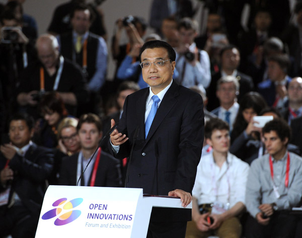 Chinese Premier Li Keqiang addresses the opening ceremony of Open Innovations Forum in Moscow, capital of Russia, Oct 14, 2014. [Photo/Xinhua]