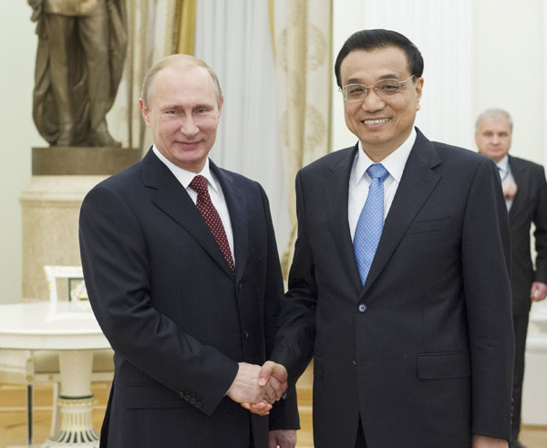 Premier Li Keqiang meets Russian President Vladimir Putin at the Kremlin in Moscow on Tuesday. Rao Aimin / Xinhua