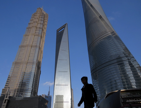 Premium office buildings in the Lujiazui financial district in Shanghai. The city accounted for the lion's share of demand for prestigious office buildings, driven by the growing needs of the financial services sector. [Photo provided to China Daily]  
