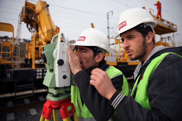 Technicians survey the AnkaraIstanbul highspeed railway, which was constructed by China Railway Construction Corp Ltd, in Turkey. China's ODI in the nonfinancial sectors totaled $74.96 billion in the first three quarters of this year. GAO BIN / XINHUA  