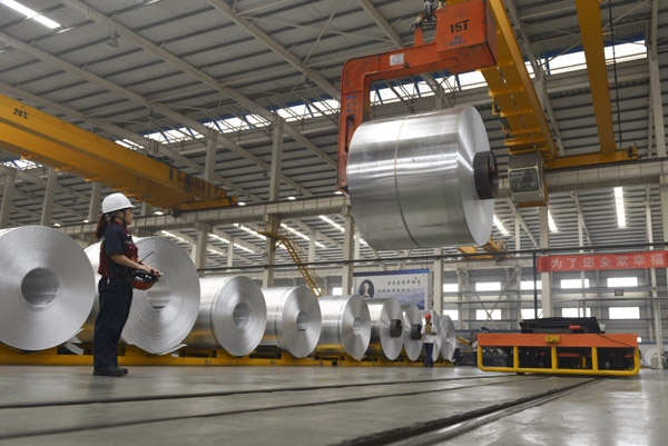 An aluminum sheet processing plant in Zouping county, Shandong province. Global demand for aluminum sheets for vehicles is forecast to record a compound annual growth rate of 30 percent by the end of 2020. [Provided to China Daily]  