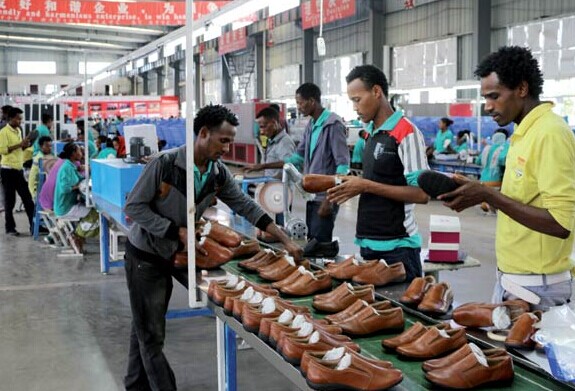 Workers operate on the production line in the Dukem, Addis Ababa, workshop of Huajian International Shoe City (Ethiopia) Plc. CHEN WEIHUA/CHINA DAILY  