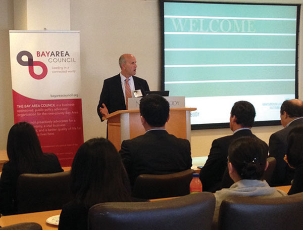 Jim Wunderman, CEO of the Bay Area Council, introduces the basic information about California to the Chinese delegation of 15 senior executives of Chinese companies and venture capitalists during a roundtable event at the office of Nixon Peabody LLP in San Francisco on Tuesday. LianZi / China Daily
