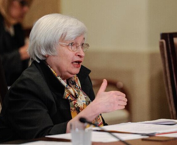 File photo taken on Oct. 22, 2014 shows U.S. Federal Reserve Chair Janet Yellen (L) speaking at an open meeting at the U.S. Federal Reserve in Washington D.C., capital of the United States. The Federal Reserve said Wednesday that it decides to end its monthly asset purchase program, as it sees the economy is improving on track from the worst financial crisis in decades. (Xinhua/Bao Dandan) 