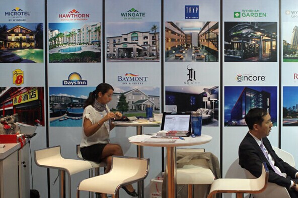 A stand promoting hotels at a business travel expo in Beijing. The Global Business Travel Association said Chinese companies will generate $262 billion worth of business travel this year, a 15.9 percent growth over last year. [Zou Hong / China Daily]  