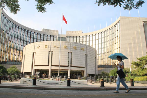 The headquarters of the People's Bank of China in Beijing. The central bank will reportedly inject 500 billion yuan ($81 billion) into the nation's largest banks. SHI YAN/CHINA DAILY  