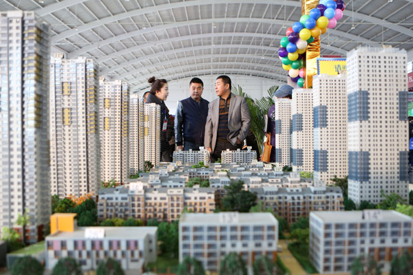 A housing exposition in Shenyang, Liaoning province, which opened on Friday. Home sales by floor space in the first 10 months dropped 9.5 percent from a year ago in the 70 cities monitored by the National Bureau of Statistics. [Yao Jianfeng / Xinhua]  
