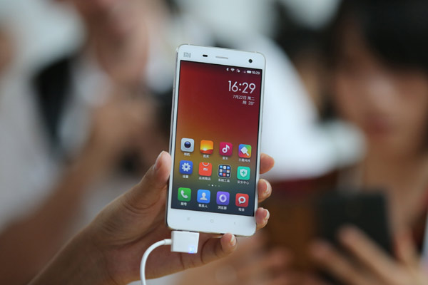 A new model of smartphones unveiled by Xiaomi Corp in Beijing. The smartphone maker has charted a roadmap for a bigger presence in the video and content services market. [Wang Jing / China Daily]  