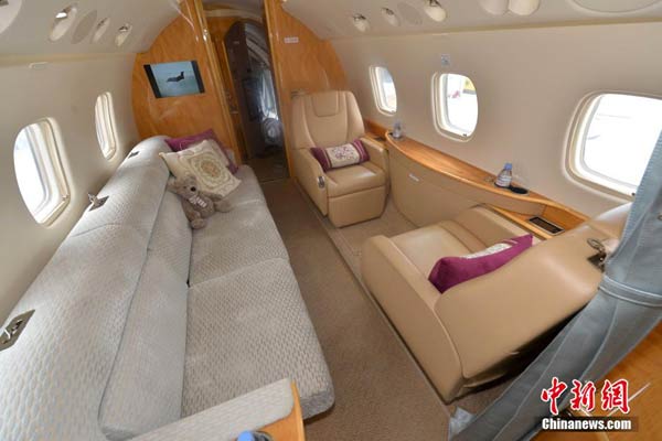 A business jet's cabin is pictured at the 5th Hainan Rendez-Vous, jets, yachts and life classics show in Sanya, South China's Hainan province on March 27, 2014. [Photo / Chinanews.com]
