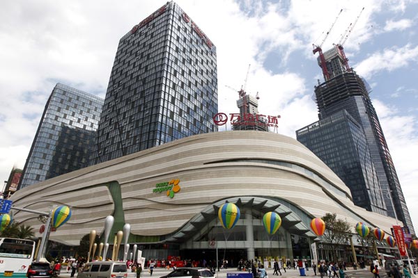 Wanda Plaza, a residential-commercial complex developed by Dalian Wanda Commercial Properties Co, gets ready to open in Chengdu, Sichuan province on Oct 31. The firm owns and manages 89 such shopping malls across the country. PROVIDED TO CHINA DAILY  