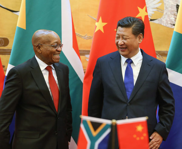 President Xi Jinping and his South African counterpart Jacob Zuma attend a bilateral signing ceremony in Beijing on Thursday. China and South Africa signed 11 agreements. PHOTO BY WU ZHIYI / CHINA DAILY  