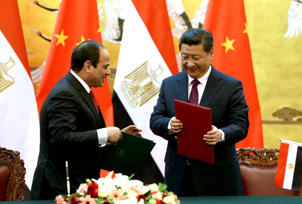 President Xi Jinping and visiting Egyptian President Abdel Fattah al-Sisi signed a document at the Great Hall of the People in Beijing on Tuesday establishing a comprehensive strategic partnership. WU ZHIYI /CHINA DAILY  