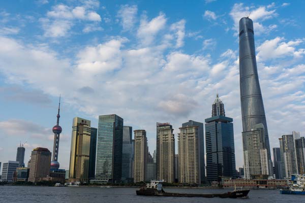 Shanghai Tower (the highest in the picture), a new landmark of Shanghai's financial hub Lujiazui, is nearly complete. Many RICS members have been involved in the project from the beginning. [Provided to China Daily]  