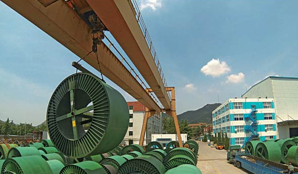Electrical cable being loaded for shipment at a Qingdao Hanhe Cable Co Ltd unit in Africa.[Photo provided to China Daily]   
