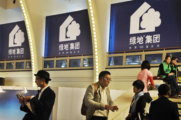 A stand of Greenland Holding Group Co Ltd at a housing expo in Shanghai. Greenland said on Sunday that its sale value in 2014 rose 48 percent to 240.8 billion yuan ($38.7 billion). Provided to China Daily  