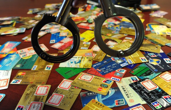 Credit cards are confiscated by police during an operation aimed at combating financial crime in Nanjing, Jiangsu province. Provided to China Daily