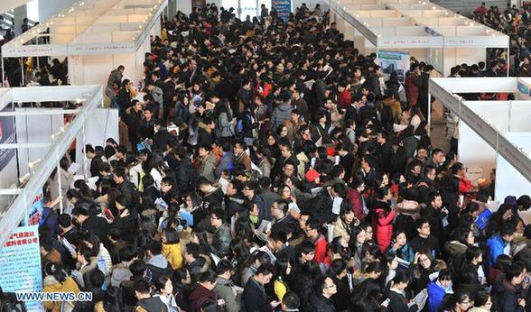 Job seekers attend a job fair for postgraduates in Beijing, capital of China, Dec 18, 2014. About 18,000 opportunities were offered at the fair. [Photo/Xinhua]  