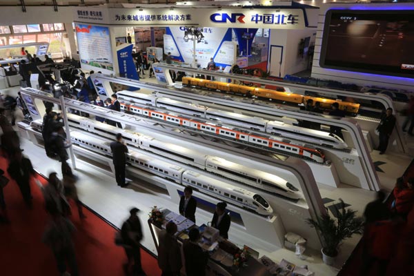 Models of CNR Corp Ltd's high-speed trains on display at a railway technology and equipment expo in Beijing. The planned merger of CSR Corp and CNR Corp is subject to antitrust reviews by other governments. [Photo/China Daily] 