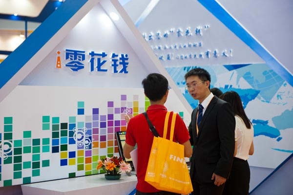The stand of an online finance company at a financial expo in Shenzhen, Guangdong province. Transactions involving P2P platforms doubled to 250 billion yuan in 2014. [Photo/Xinhua] 