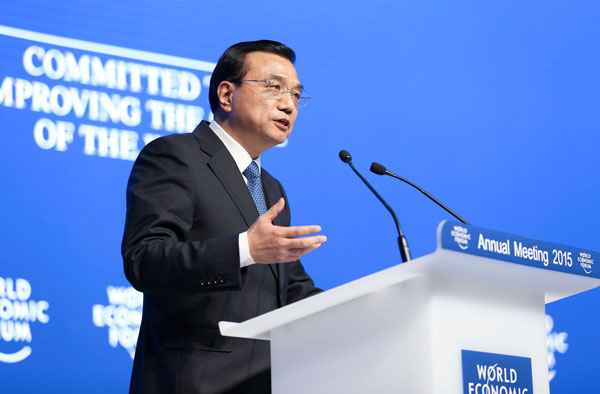 Premier Li Keqiang addresses the World Economic Forum's annual meeting in Davos on Wednesday. LIU ZHEN / CHINA NEWS SERVICE 