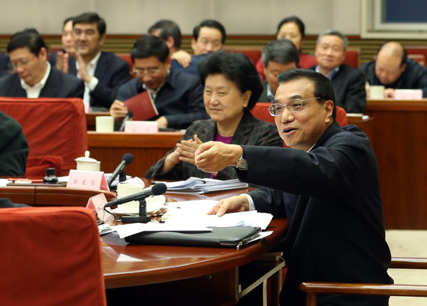 Premier Li Keqiang speaks during a meeting with representatives from the business sector on Monday in Beijing. Li sought their opinions on the Government Work Report. WU ZHIYI / CHINA DAILY