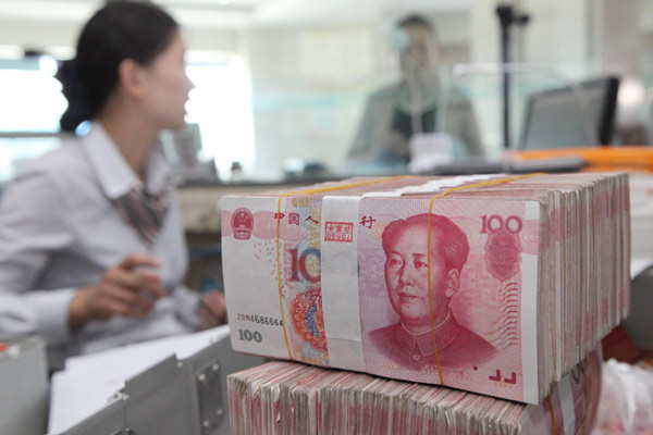 The yuan slid 0.41 percent to 6.2542 per dollar in Shanghai on Jan 26, extending a decline of 0.31 percent on last Friday, according to securities information provider Wind Information Co Ltd.[Si Wei / China Daily] 
