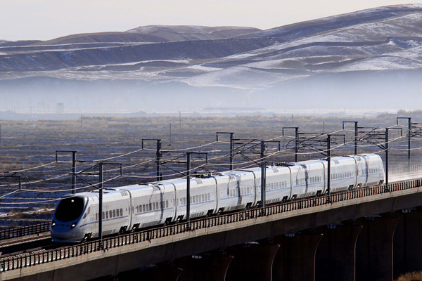 A bullet train makes a trial trip in December from Xining to Lanzhou in Northwest China. The Lanxin high-speed railway links Urumqi, in the Xinjiang Uygur autonomous region, with Xining, Qinghai province, and Lanzhou, Gansu province. It slashes the travel time from more than 23 hours to just under 12. Cai Zengle / Xinhua