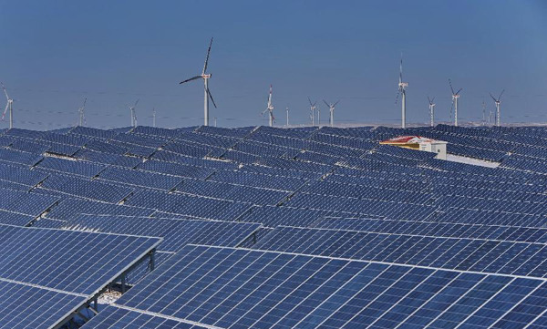 A photovoltaic power plant and a nearby wind power farm in Zhangjiakou, North China's Hebei province,Jan 19, 2015.[Photo/Xinhua]