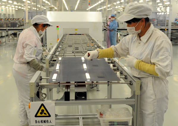 A workshop of Hanergy Holding Group Ltd in Dezhou, Shandong province. The company will develop a totally solar-powered car that can go into commercial production in October. [Photo provided to China Daily]
