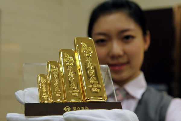 Gold bars celebrating the Year of the Ram on sale at the Beijing Caibai Shopping Mall. China is the world's top producer of gold. [Photo provided to China Daily]