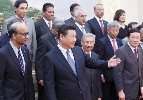 President Xi Jinping and representatives from the 21 countries involved in setting up the Asian Infrastructure Investment Bank meet at the Great Hall of the People in Beijing on Friday. Each nation's stake in the lender has been generally allocated based on its GDP. WU ZHIYI / CHINA DAILY