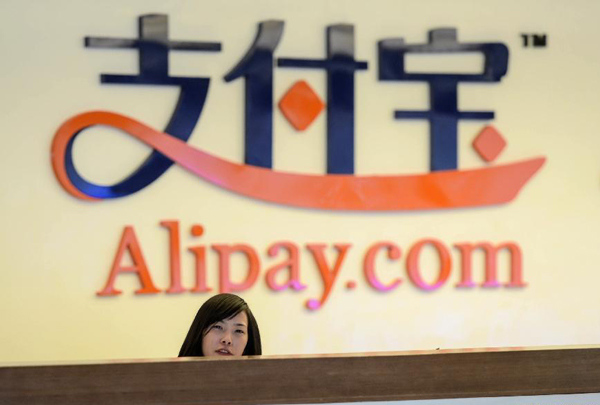 A receptionist works at Alipay's headquarters in Hangzhou, capital of East China's Zhejiang province, in this Jan 10, 2014 file photo. [Photo/Xinhua]