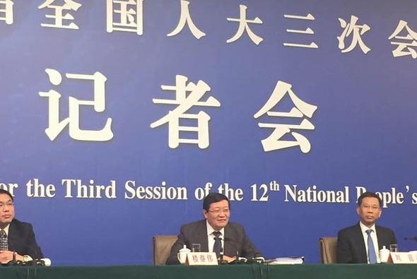 China's Finance Minister Lou Jiwei (center) takes questions from journalists at a news conference during the ongoing two sessions on March 6. (Photo: chinadaily.com.cn/Li Xiang)  