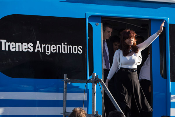 Argentine President Cristina Fernandez de Kirchner waves to crowds after inspecting one of the 300 railway carriages made by CSR that arrived in Buenos Aires from China. They form part of Argentinas plans to upgrade a major railway line. MARTIN ZABALA / XINHUA