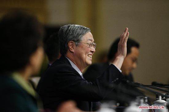 Zhou Xiaochuan, governor of the People's Bank of China, answers questions at a press conference for the third session of the 12th National People's Congress (NPC) on financial reform in Beijing, capital of China, March 12, 2015. (Xinhua/Yin Gang)