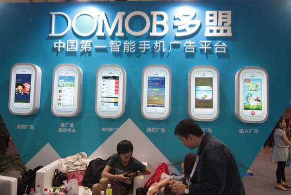 Domob Mobile Advertising Network stand at the Global Mobile Internet Conference last year in Beijing. Revenue from the Internet advertisement market in China jumped 36.7 percent year-on-year to 90 billion yuan in 2014.(Photo/Provided to China Daily)