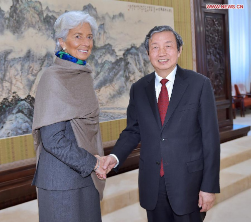 Chinese Vice Premier Ma Kai (R) meets with Christine Lagarde, managing director of the International Monetary Fund (IMF), in Beijing, capital of China, March 23, 2015. (Xinhua/Li Tao)