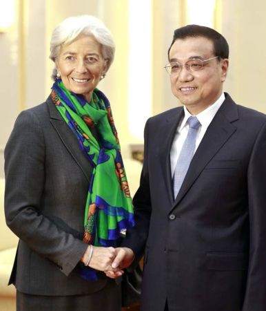 Premier Li Keqiang meets Christine Lagarde, president of the International Monetary Fund, at the Great Hall of the People in Beijing, March 23, 2015. (Feng Yongbin/China Daily)