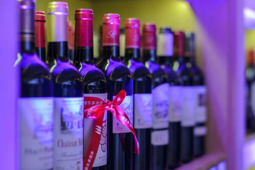 Wines displayed in la Bordeauxthéque at its grand opening party, in the newly-launched French department store Galeries Lafayette, in Beijing on Feb 27, 2014. (Photo/chinadaily.com.cn)  