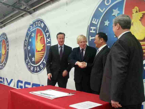 British Prime Minister David Cameron and The Mayor of London Boris Johnson visit the London Taxi Company in Coventry, United Kingdom on Mar 26.(Provided to China Daily)