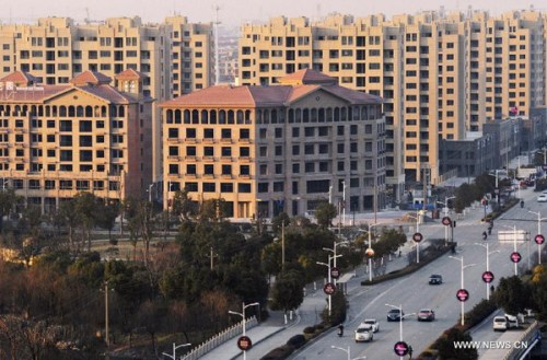 Photo taken on Jan 1, 2015 shows an apartment project in Huzhou, East China's Zhejiang province. (Photo/Xinhua)  