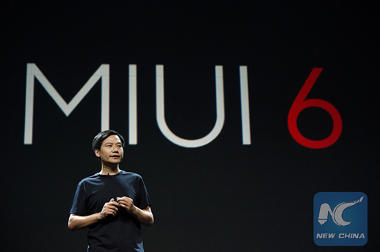 Lei Jun, CEO of China's smartphone manufacturer Xiaomi, introduces the research and development process of Xiaomi products during its annual new product release conference held in Beijing, July 22, 2014. (Xinhua/Zhang Jin)
