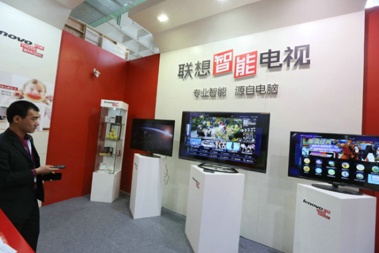Smart TVs of Lenovo Group Ltd on display at a home appliance expo in Beijing. The company is setting up a new subsidiary to sell televisions online. (Photo/China Daily)