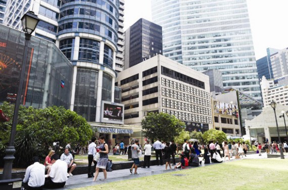 Office workers walk around during the lunch break in the financial district in Singapore. The total daily turnover of yuan foreign exchange transactions in the city-state doubled to $31 billion the year after it became an offshore yuan center in late 2013. (Photo/China Daily)