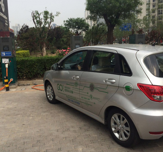 A new-energy car is being charged in a community in Beijing. The government launched a slew of new incentives to boost the use of new-energy vehicles. (Photo/China Daily)