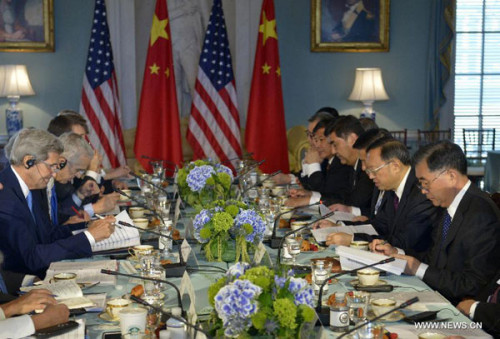 Chinese Vice Premier Wang Yang (1st R), Chinese State Councilor Yang Jiechi (2nd R) and US Secretary of State John Kerry (1st L) attend a special meeting on climate change under the framework of the seventh round of the China-US Strategic and Economic Dialogue (S&ED), in Washington D.C., the United States, on June 23, 2015.(Photo/Xinhua)