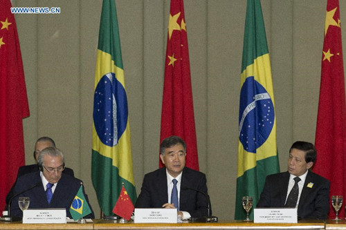 Chinese Vice Primier Wang Yang (C) and Brazilian Vice President Michel Temer (L) co-chair the fourth meeting of the China-Brazil High-Level Coordination and Cooperation Committee (COSBAN) in Brasilia, Brazil, June 26, 2015. (Xinhua/Rong Hao) 